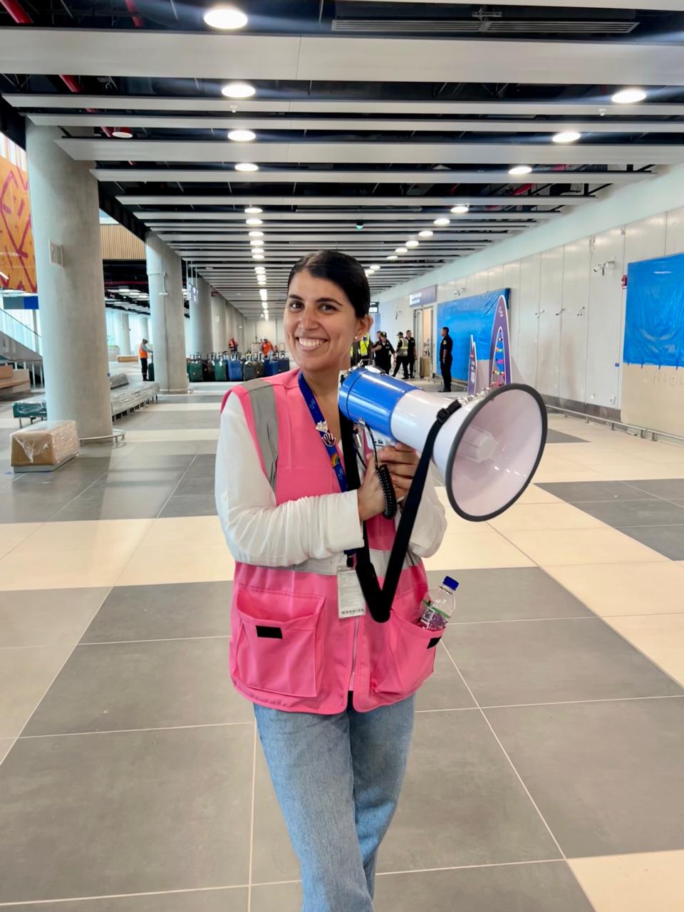 Mariale leading an internal communication moment with a megaphone